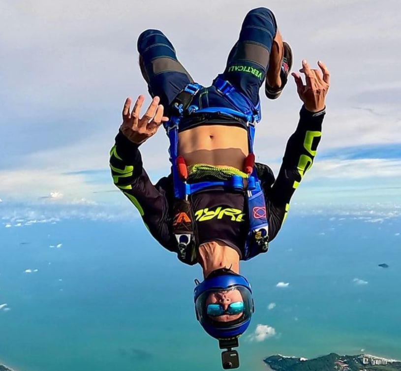 Person flying head down wearing a G35 skydiving helmet with a fixed camera