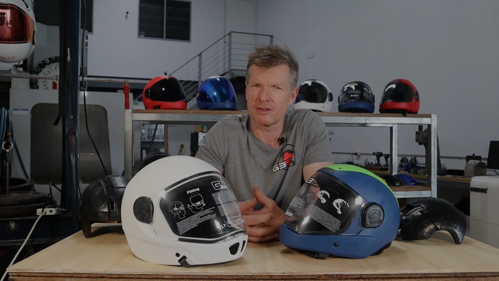 Man with Cookie G4 & G5 skydiving helmet on a table